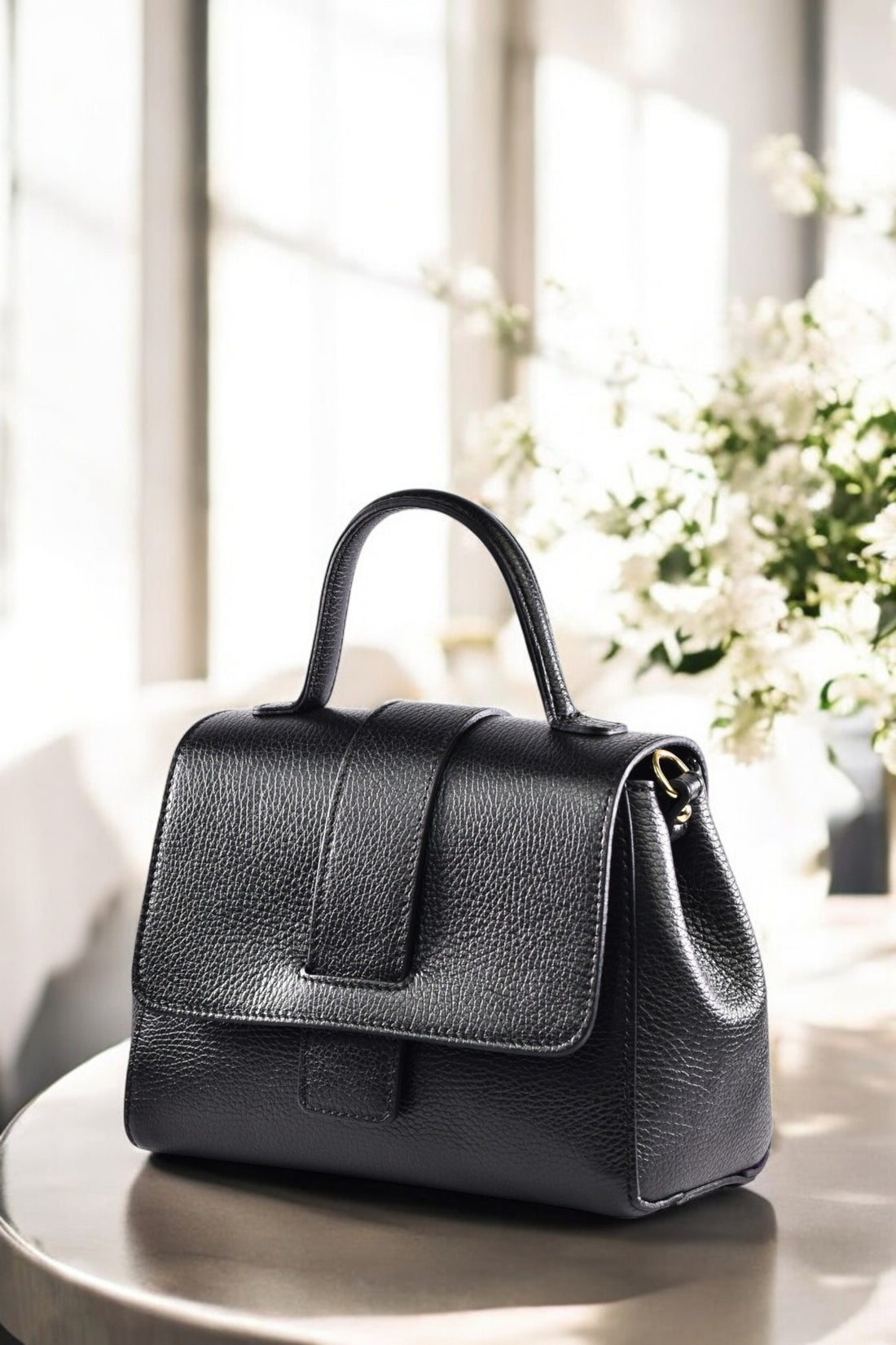 Madison bag in black Dollar leather