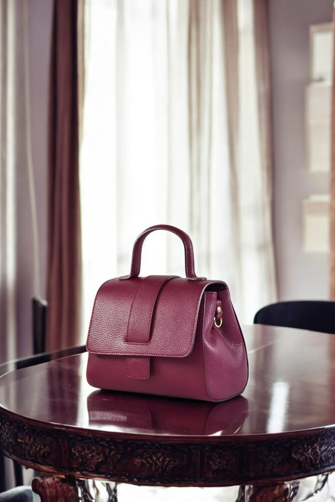Madison bag in Burgundy Dollar leather